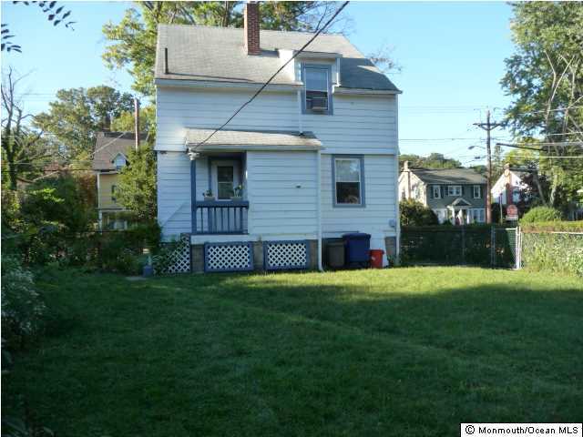 48 Ridgway Street Mount Holly, NJ 08060 - Photo 22 of 24 a front view of a house with a garden