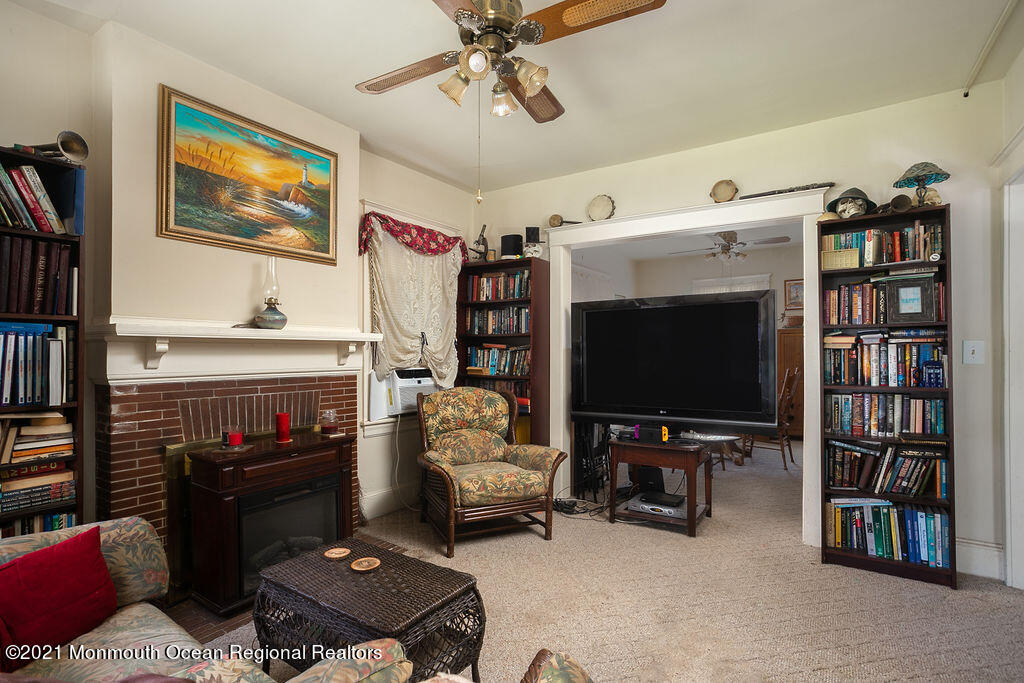 48 Ridgway Street Mount Holly, NJ 08060 - Photo 6 of 24 a living room with furniture and a flat screen tv