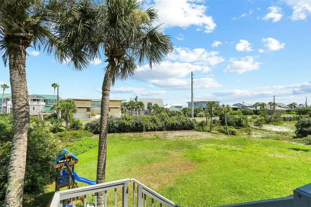 a view of a garden with an ocean