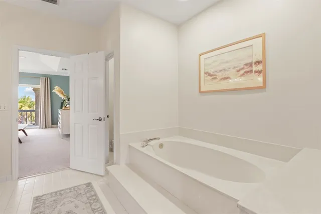 a spacious bathroom with a bathtub and a shower