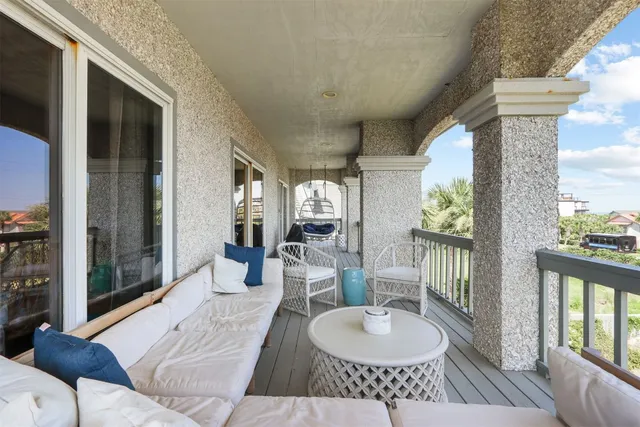 a outdoor living space with furniture and a floor to ceiling window