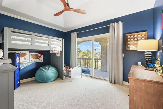 a bedroom with furniture and a flat screen tv