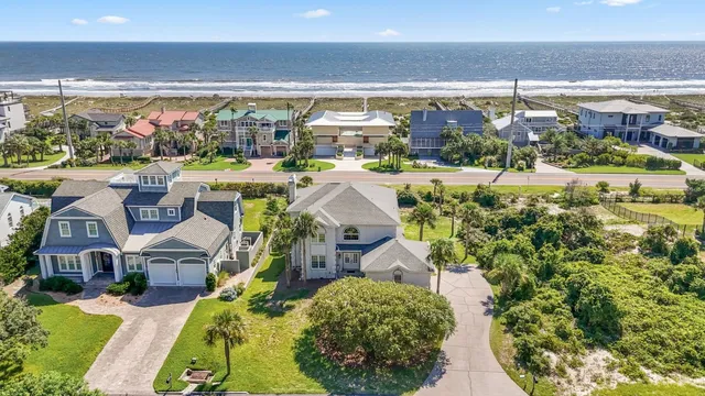 a view of houses with a yard