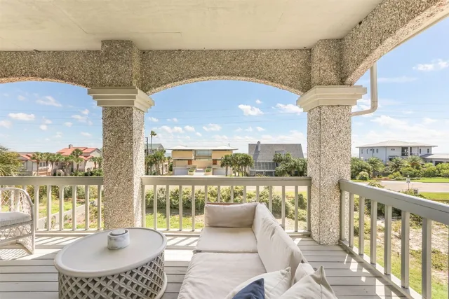 a balcony with furniture and city view