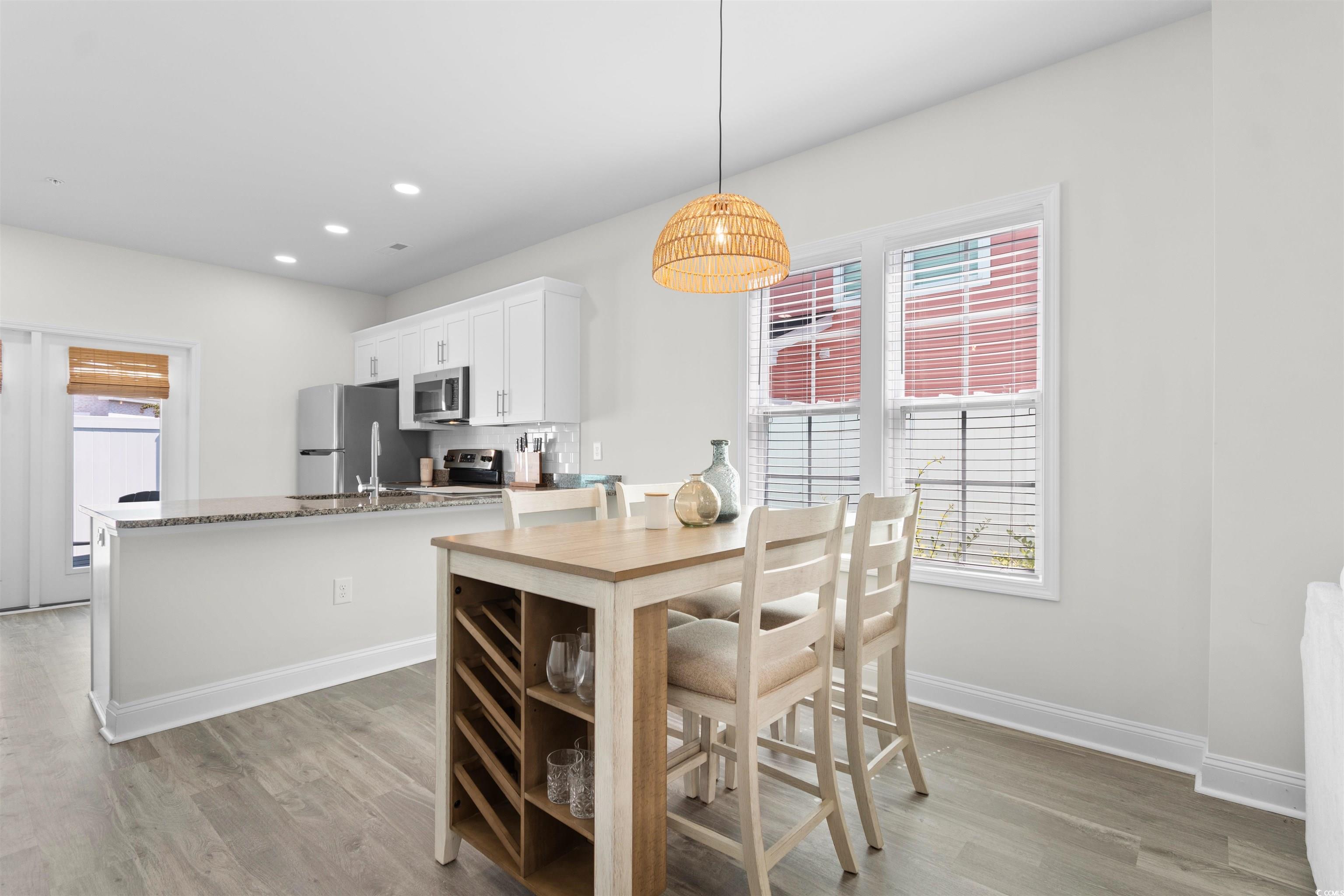 804 Moen Place, Unit F Myrtle Beach, SC 29577 - Photo 12 of 34 Dining area featuring light wood finished floors and recessed lighting