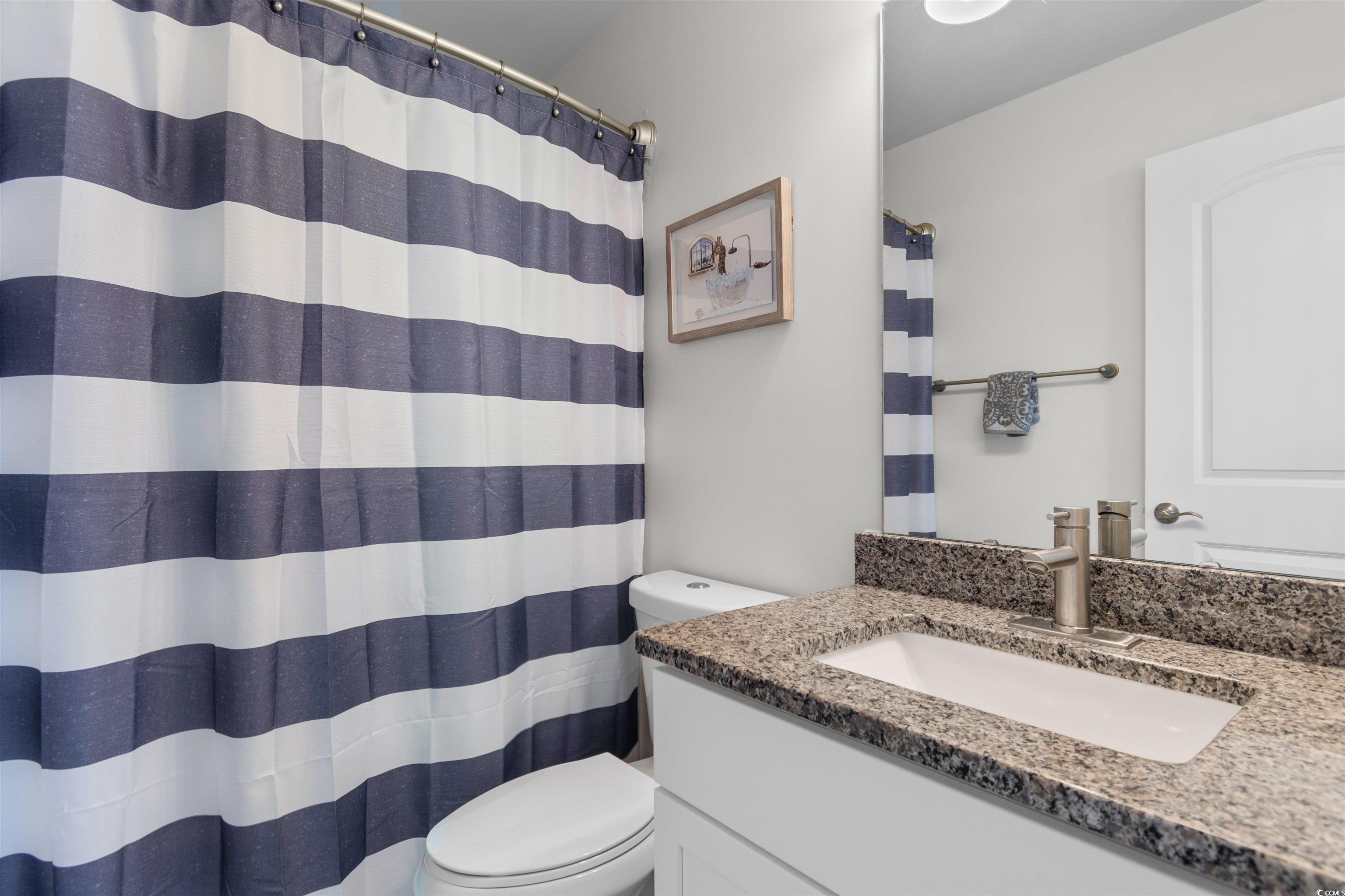 804 Moen Place, Unit F Myrtle Beach, SC 29577 - Photo 22 of 34 Full bathroom with vanity and a shower with curtain