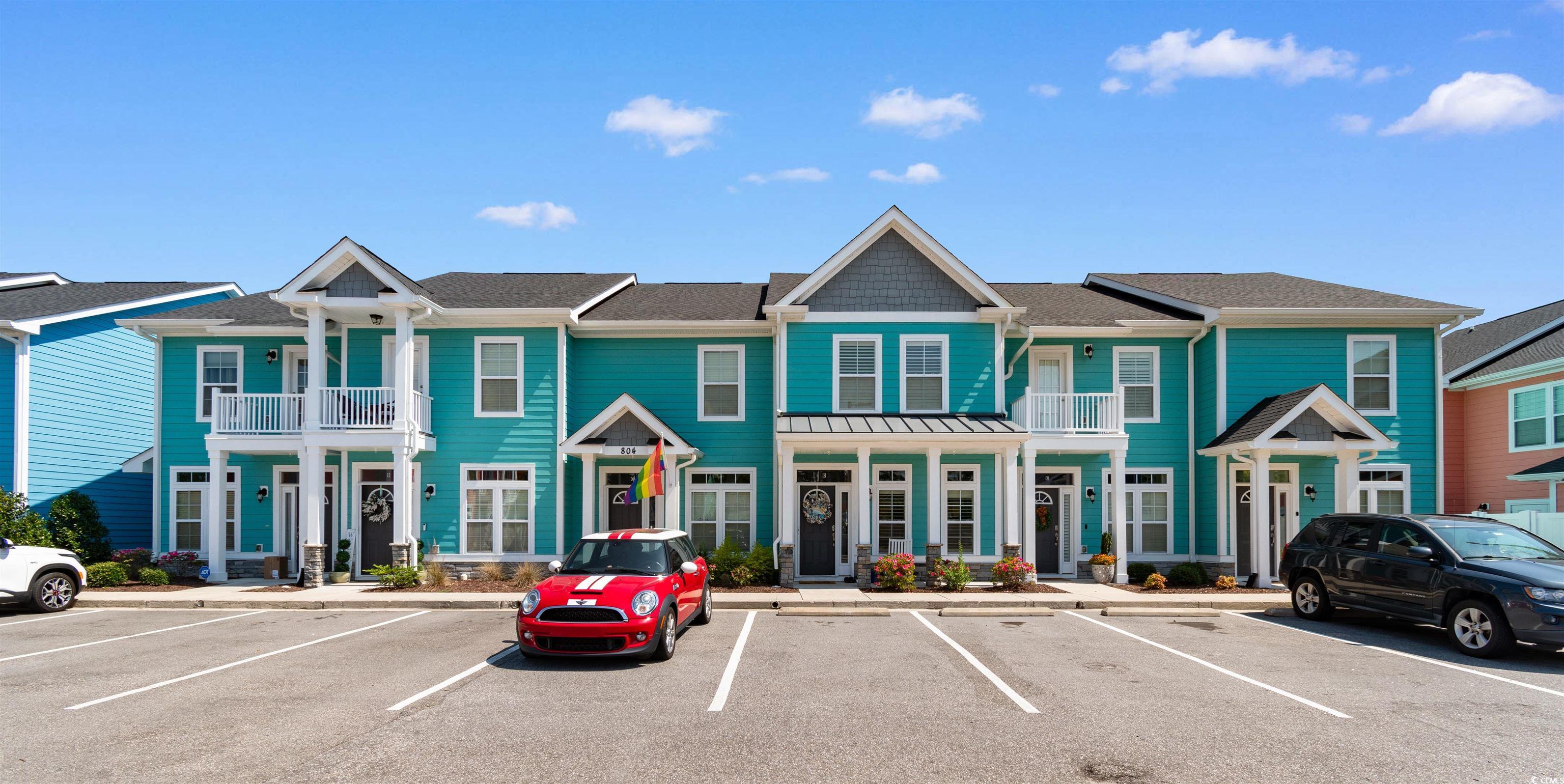 804 Moen Place, Unit F Myrtle Beach, SC 29577 - Photo 3 of 34 View of front of house with uncovered parking and a shingled roof