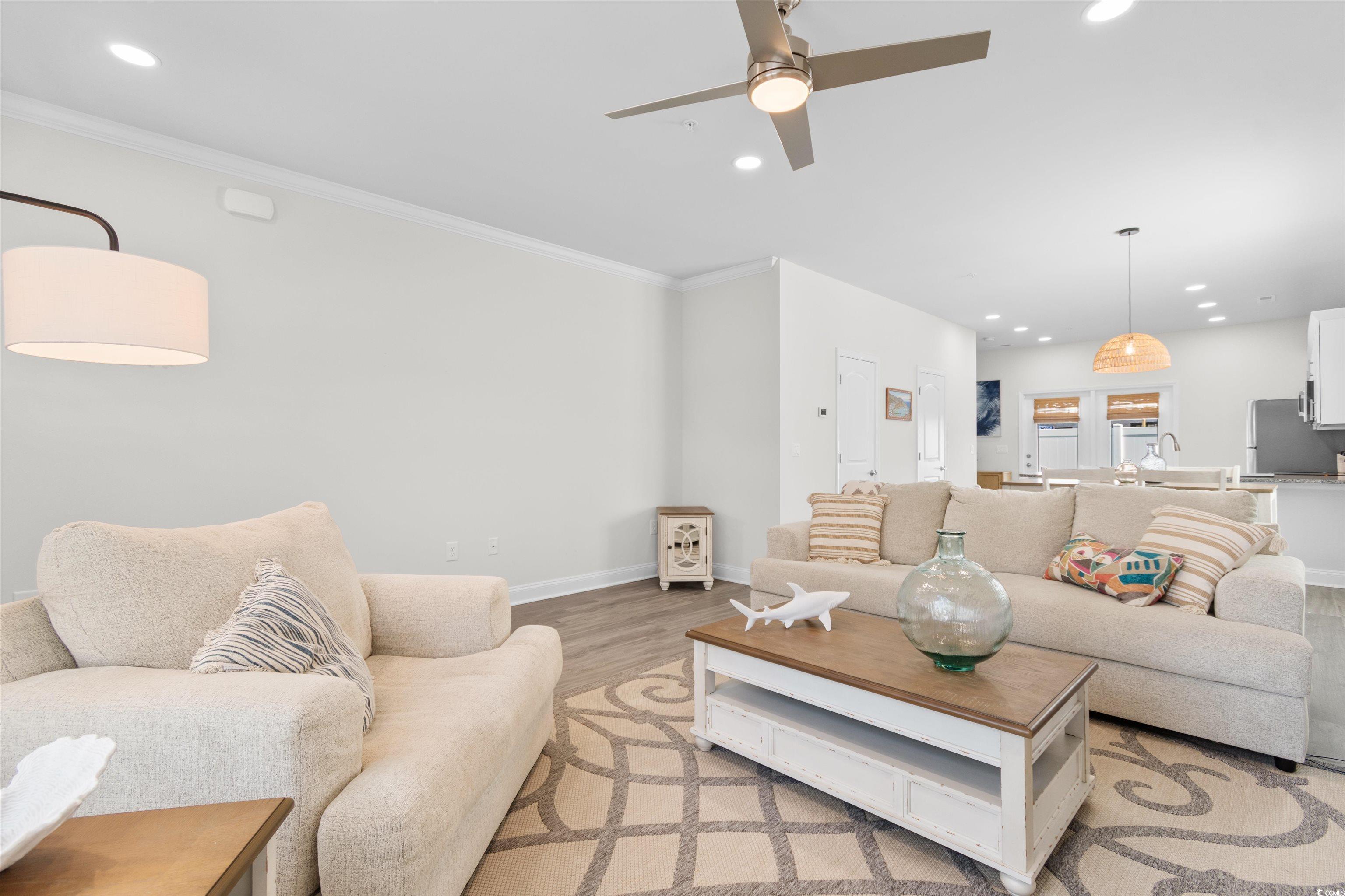 804 Moen Place, Unit F Myrtle Beach, SC 29577 - Photo 5 of 34 Living room featuring recessed lighting, light wood-style floors, crown molding, and ceiling fan