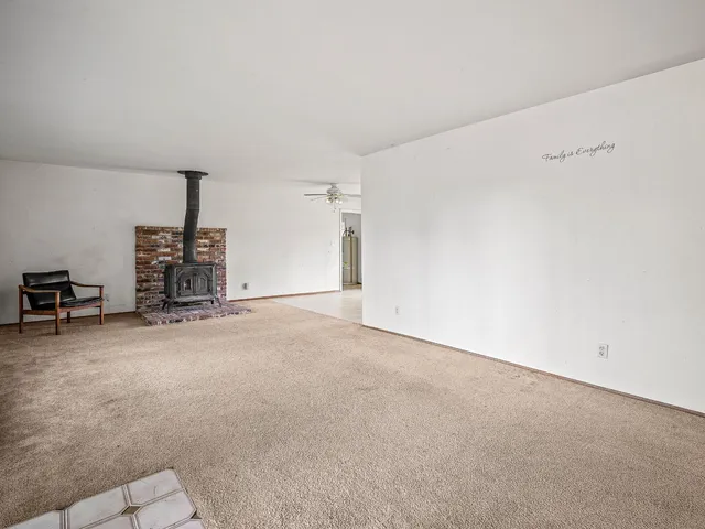 an empty room with windows and mountain view