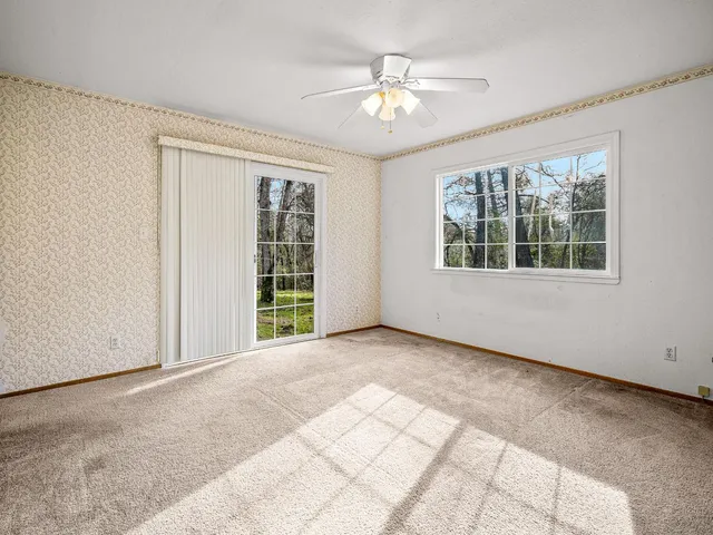 a view of an empty room with windows