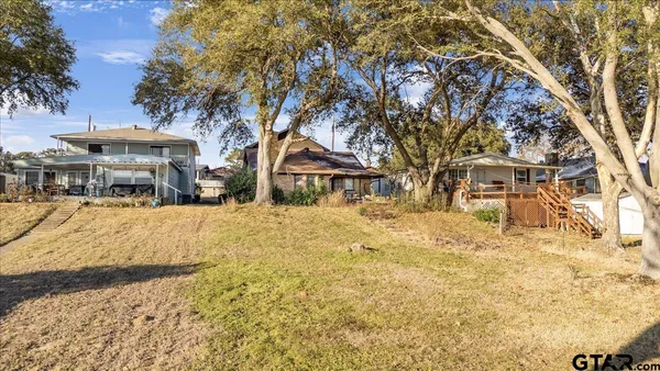 a view of house with yard