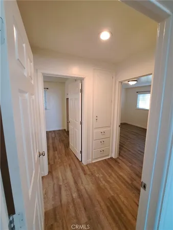 wooden floor with a bathroom