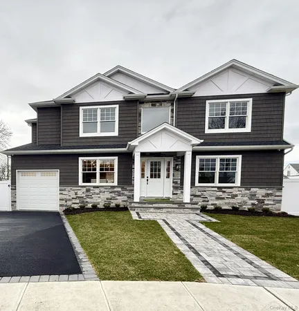 a front view of a house with yard
