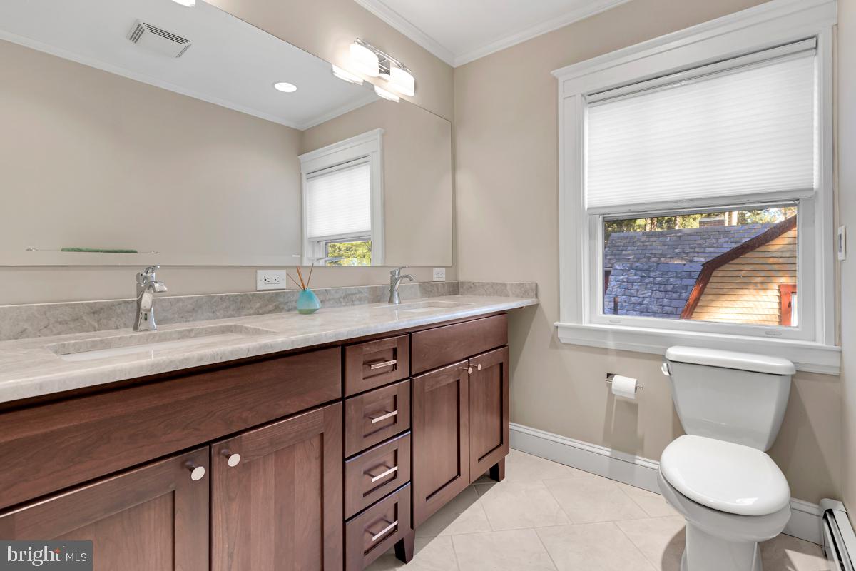 4814 Keswick Road Baltimore, MD 21210 - Photo 32 of 61 Renovated 2nd level bath with dual sinks