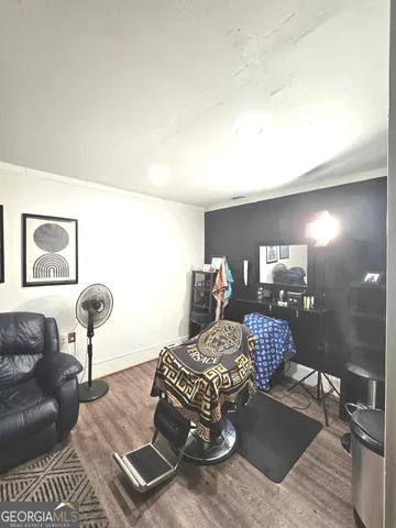 a living room with furniture and a lamp