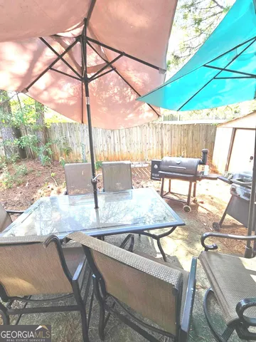 a bedroom with a bed and a television