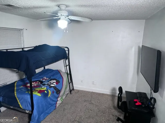 a view of a hallway with wooden floor and entryway