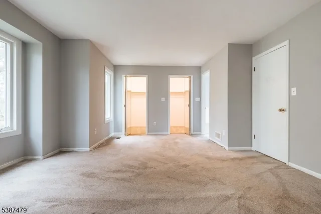 an empty room with windows