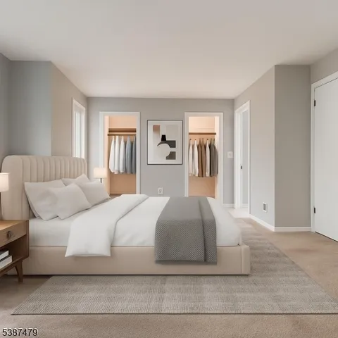 a bedroom with a large bed and a couch