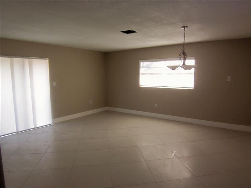 12031 Southwest 7th Street Miami, FL 33184 - Photo 4 of 12 a view of an empty room with a window