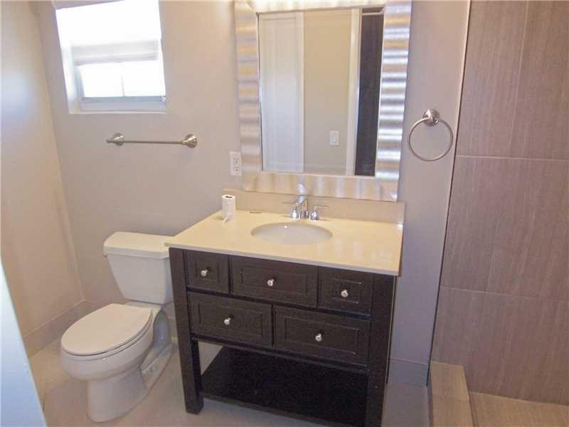 12031 Southwest 7th Street Miami, FL 33184 - Photo 8 of 12 a bathroom with a sink vanity mirror and toilet