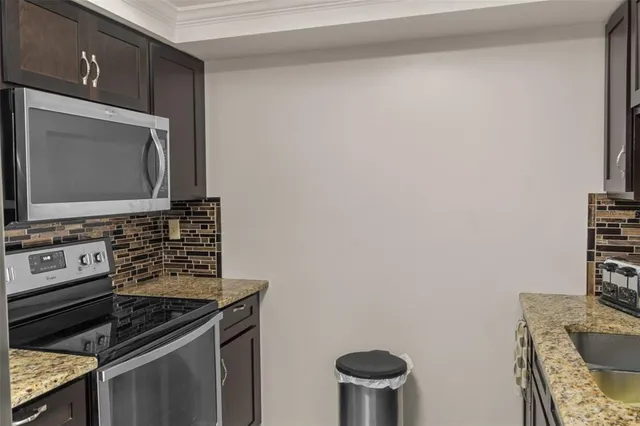 a kitchen with a stove and a microwave