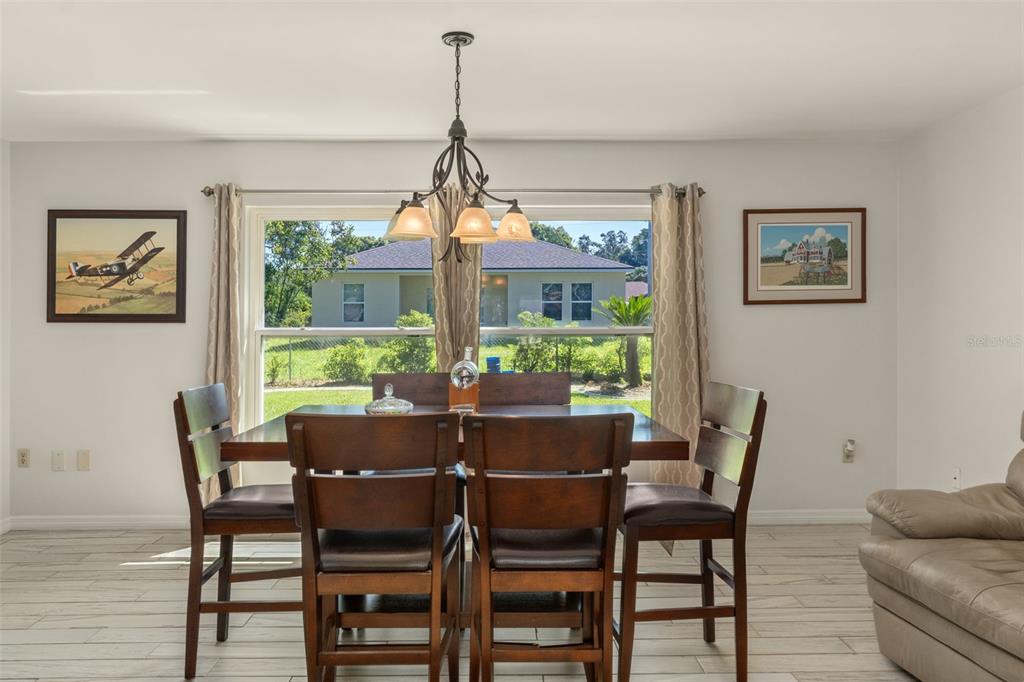 7606 Landmark Drive Spring Hill, FL 34606 - Photo 16 of 41 a view of a dining room with furniture window and outside view