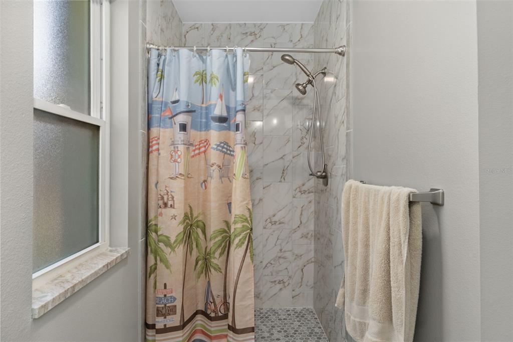 7606 Landmark Drive Spring Hill, FL 34606 - Photo 21 of 41 a bathroom with a shower