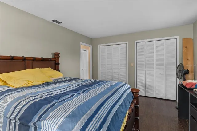 a bedroom with a bed and a bathroom