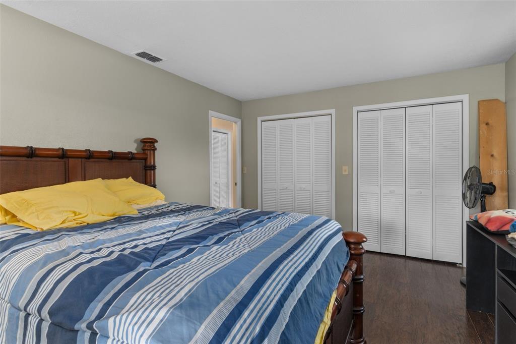 7606 Landmark Drive Spring Hill, FL 34606 - Photo 24 of 41 a bedroom with a bed and a bathroom