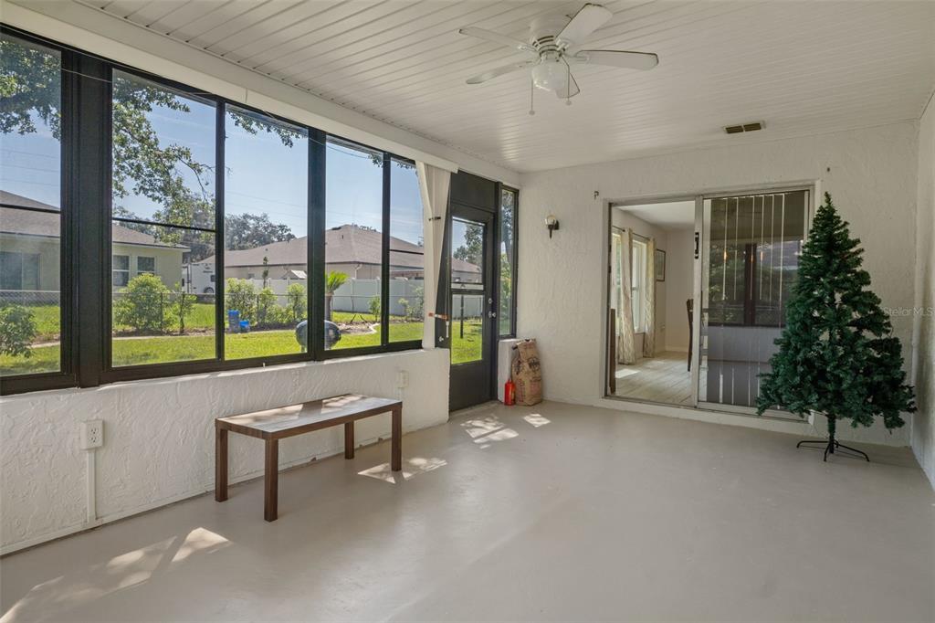7606 Landmark Drive Spring Hill, FL 34606 - Photo 30 of 41 a living room with furniture and a large window