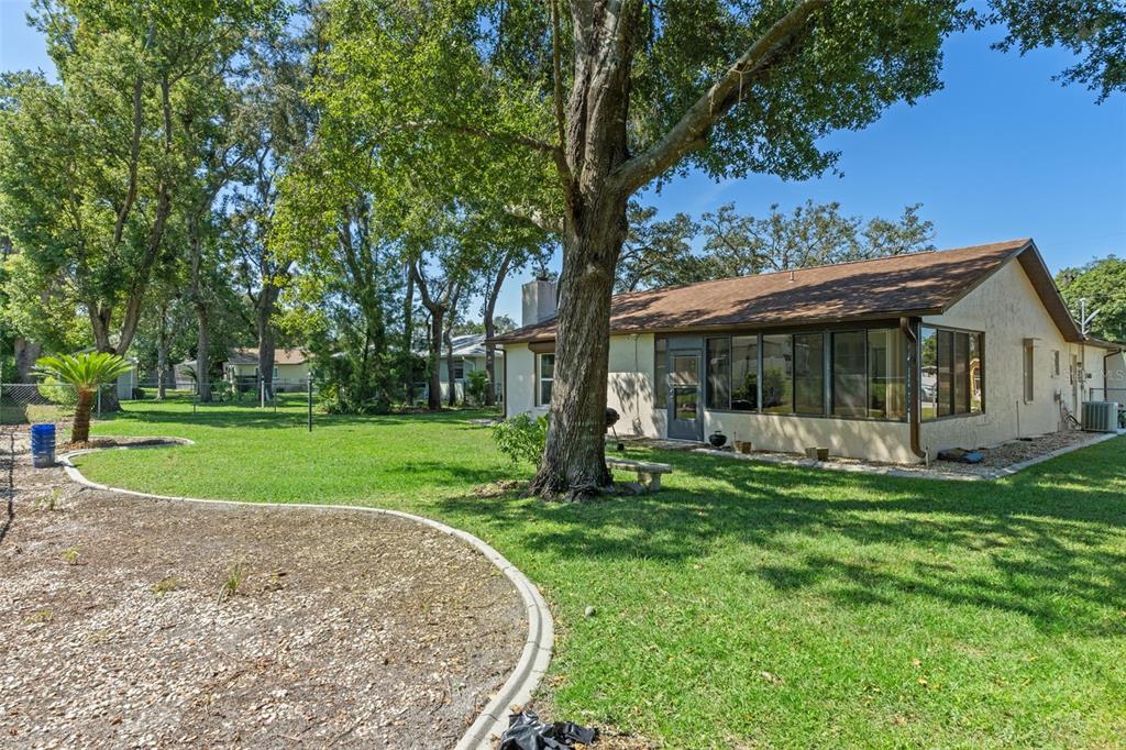 7606 Landmark Drive Spring Hill, FL 34606 - Photo 32 of 41 a view of a house with a yard