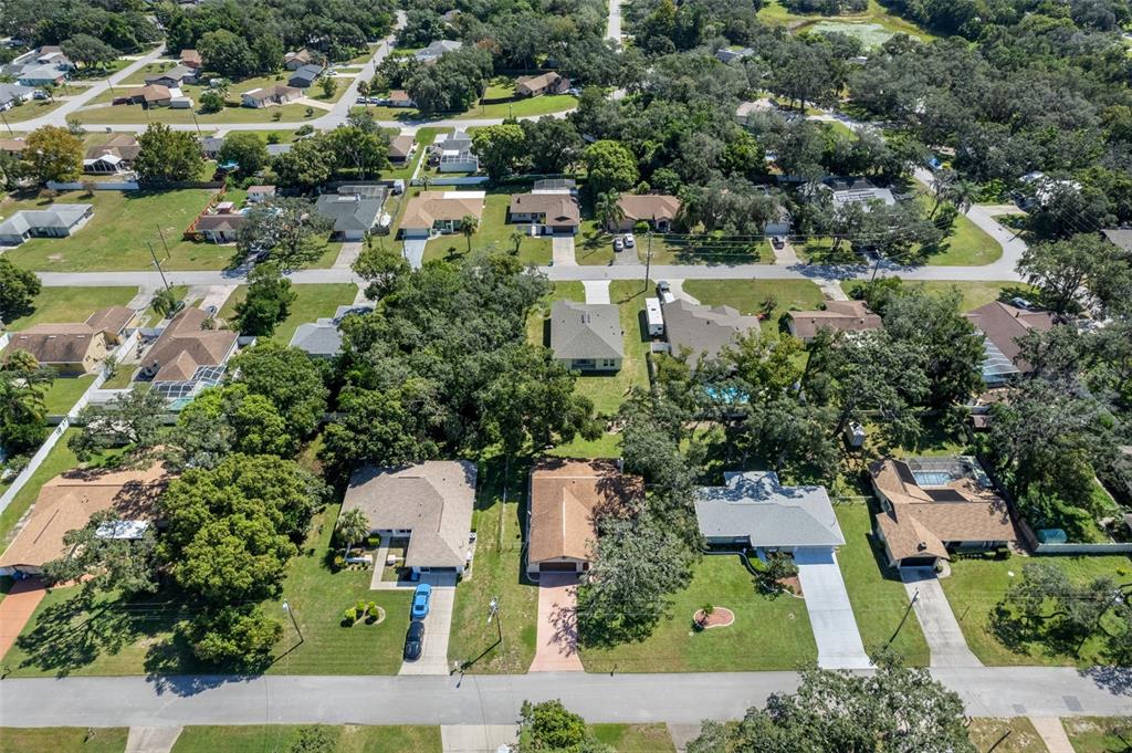 7606 Landmark Drive Spring Hill, FL 34606 - Photo 35 of 41 an aerial view of residential house with outdoor space and lake view