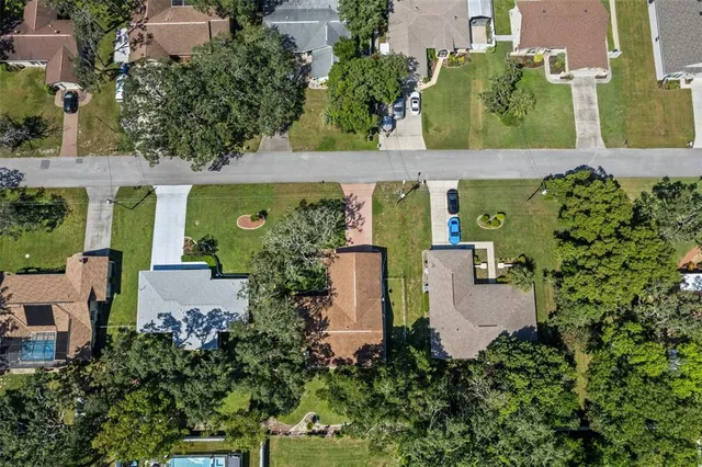 an aerial view of a house with outdoor space