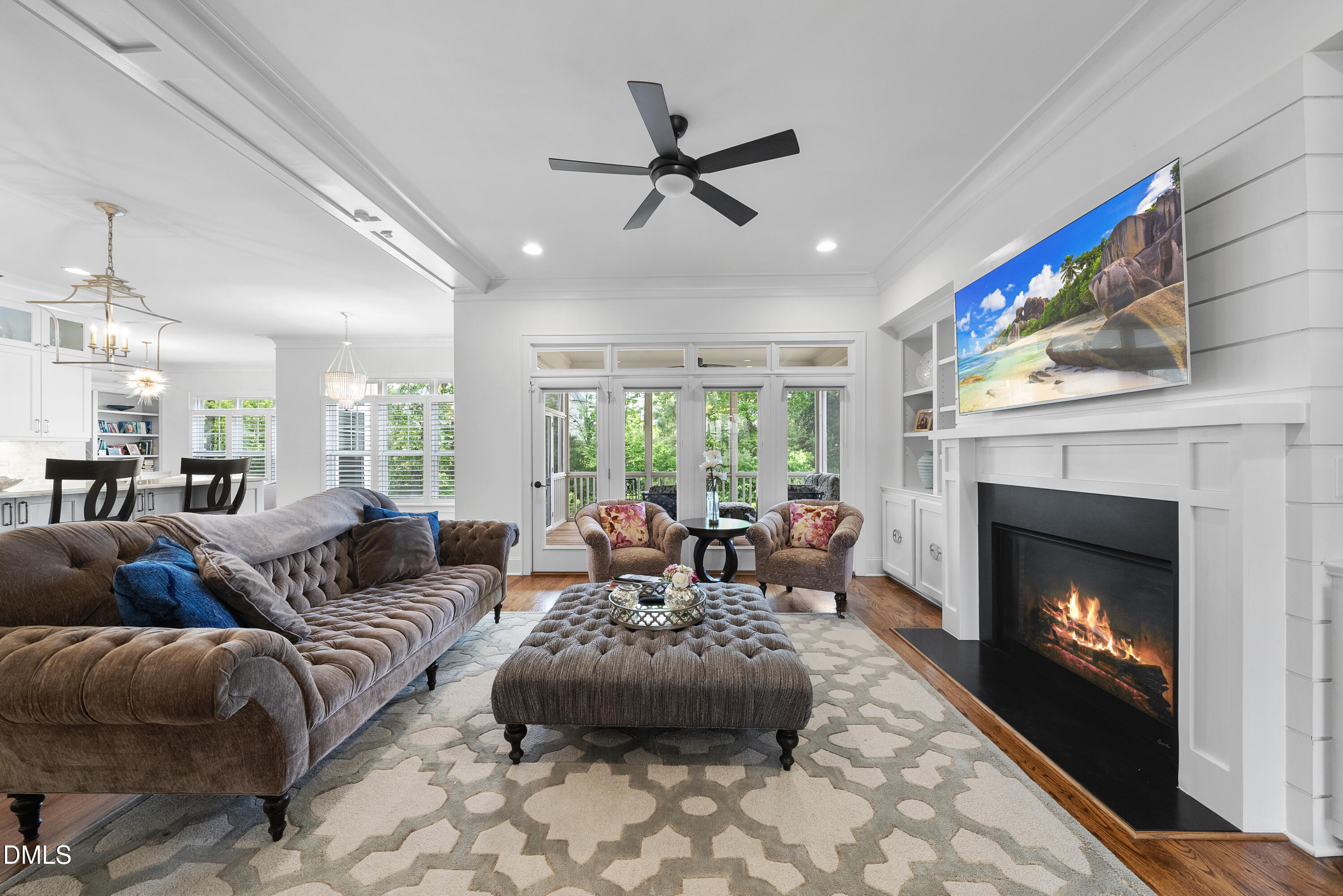 5109 Wainscott Way Raleigh, NC 27612 - Photo 9 of 52 a living room with furniture a fireplace and a large window