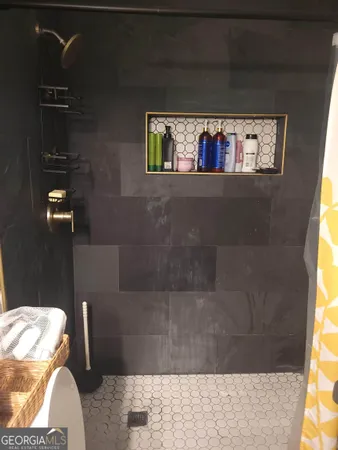 a view of a room with workspace and wooden floor