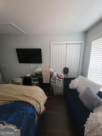 a bedroom with a bed and a sink