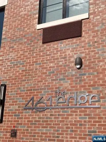 a bathroom with a brick wall and a blue wall