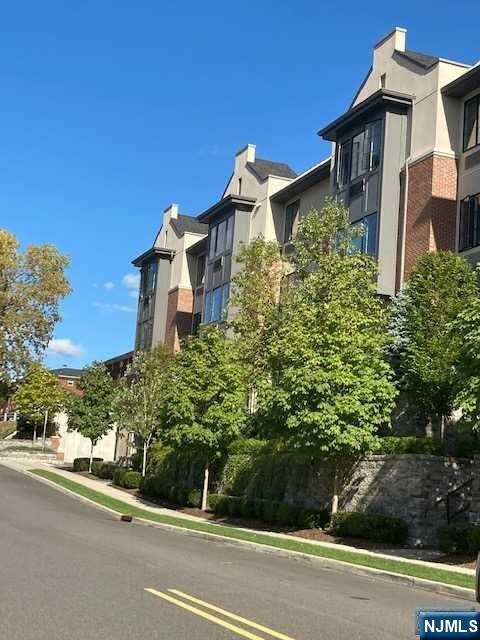 461 Palisades Boulevard, Unit 303 Fort Lee, NJ 07024 - Photo 3 of 13 front view of a house with a street