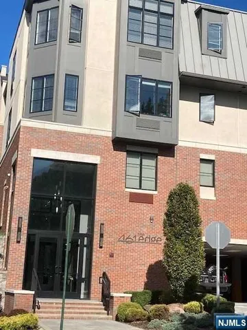 a view of a building with a street