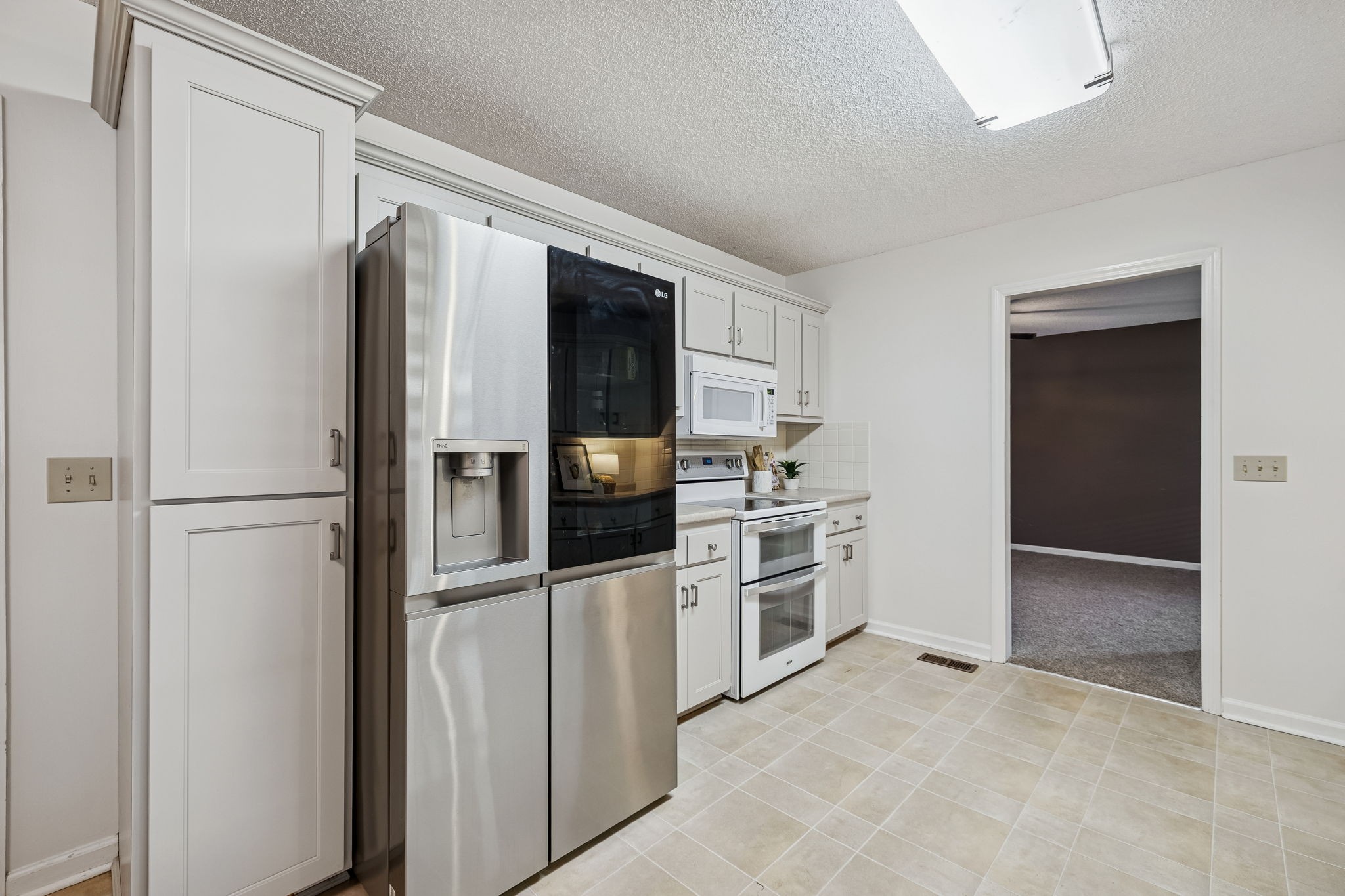 641 McKaig Road Murfreesboro, TN 37127 - Photo 12 of 51 a kitchen with stainless steel appliances a refrigerator and a stove