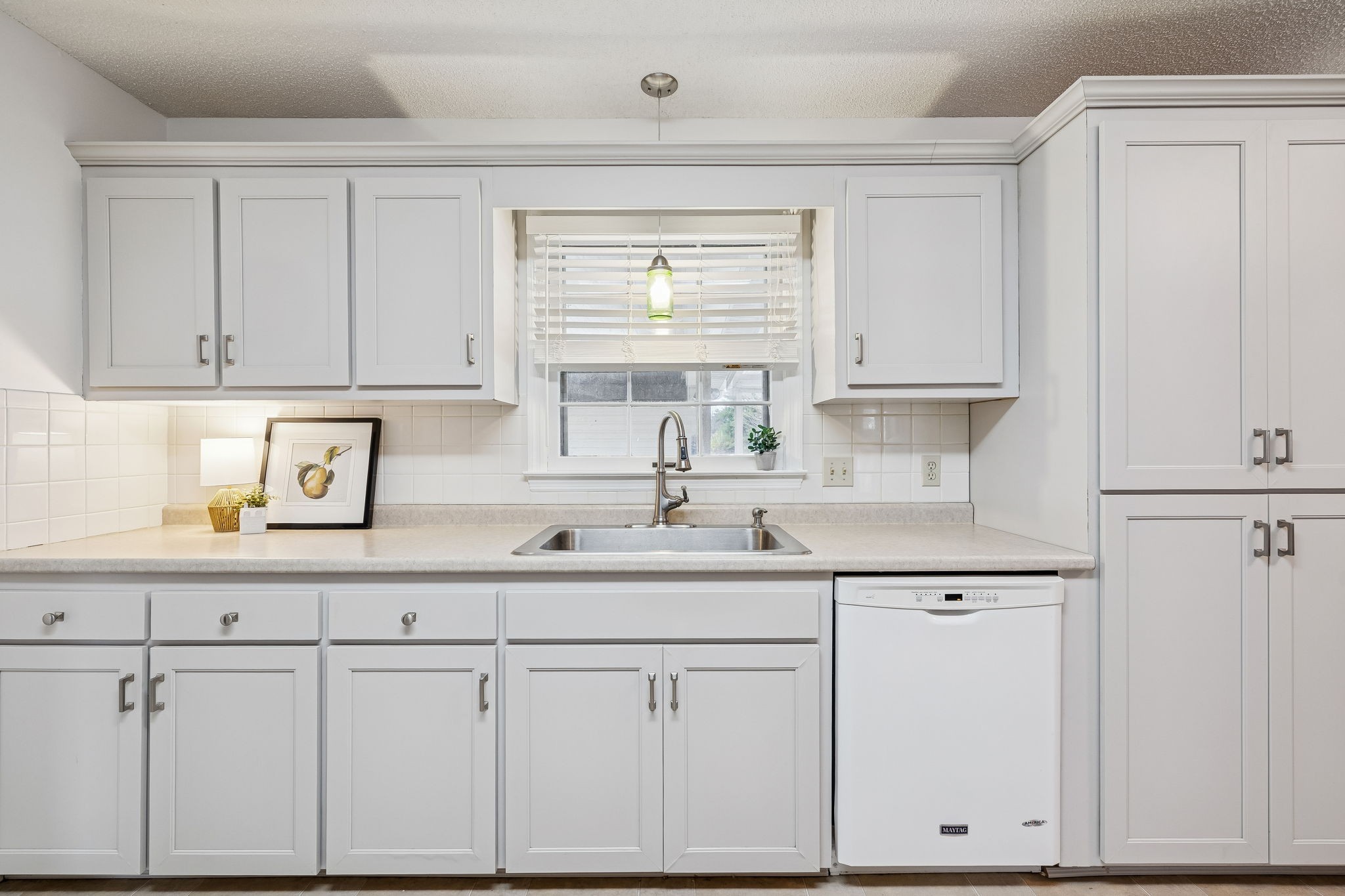 641 McKaig Road Murfreesboro, TN 37127 - Photo 13 of 51 a kitchen with white cabinets and sink