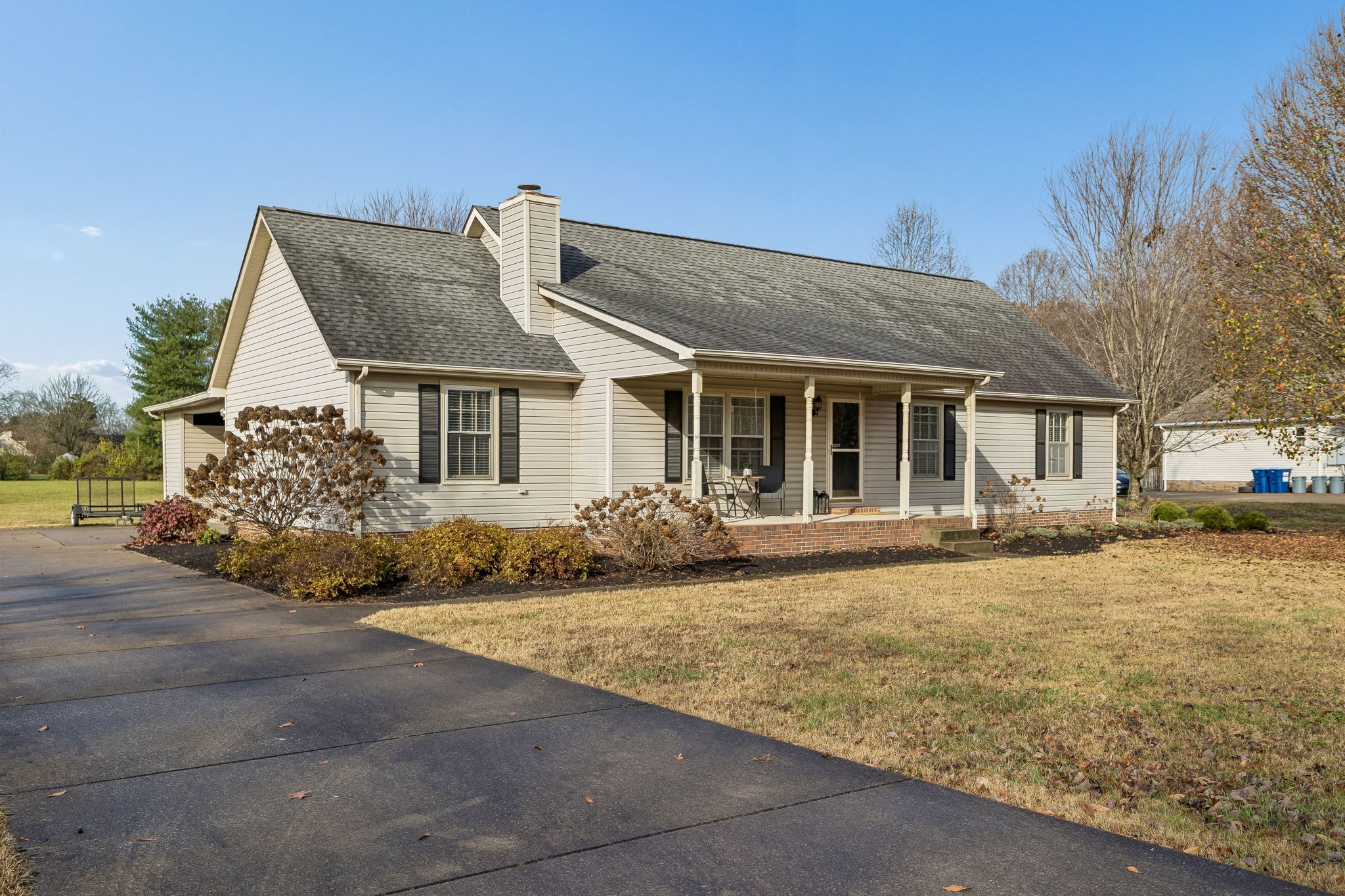 641 McKaig Road Murfreesboro, TN 37127 - Photo 2 of 51 a front view of a house with a garden and yard