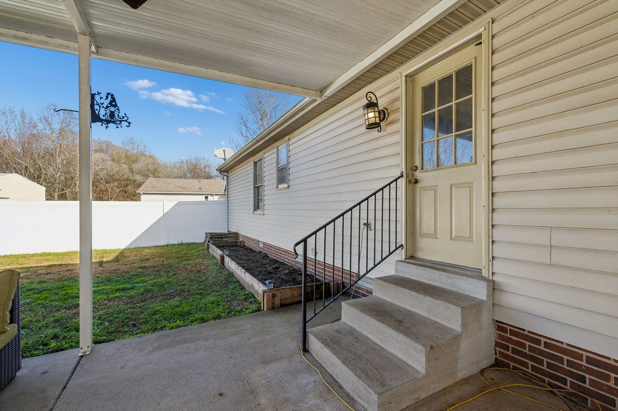 641 McKaig Road Murfreesboro, TN 37127 - Photo 31 of 51 a view of a porch with furniture and floor to ceiling window