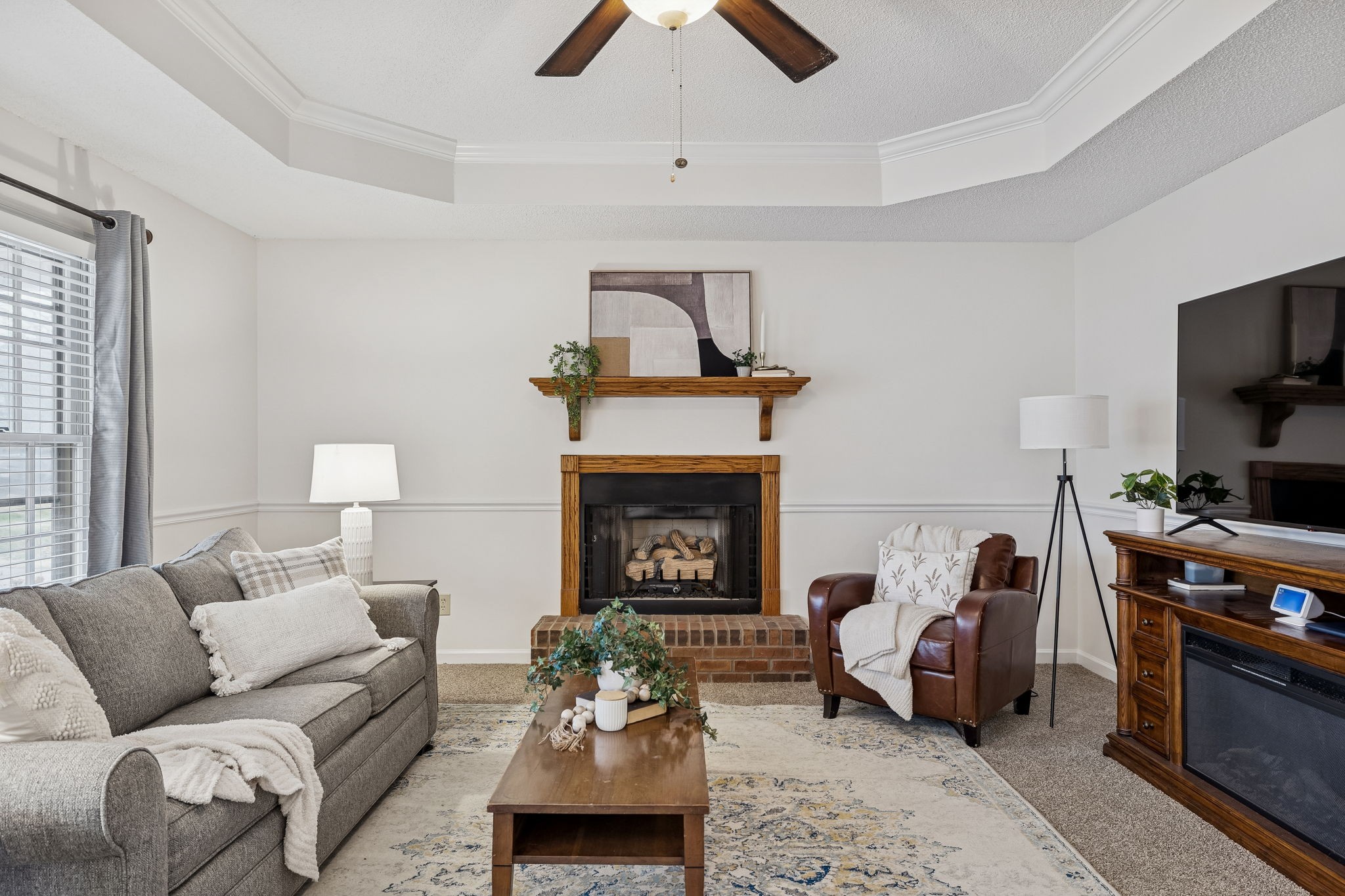 641 McKaig Road Murfreesboro, TN 37127 - Photo 5 of 51 a living room with furniture a fireplace and a flat screen tv