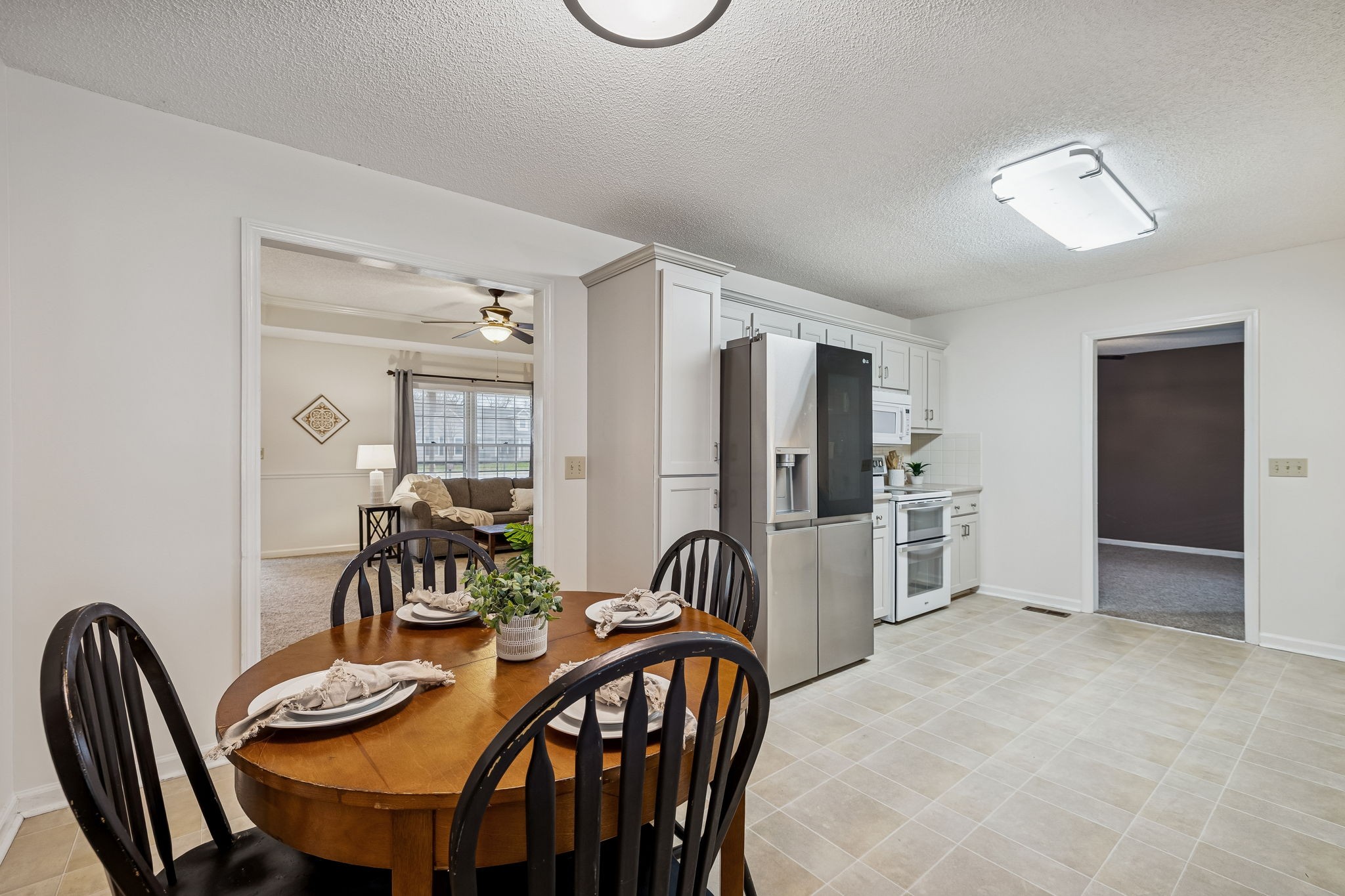 641 McKaig Road Murfreesboro, TN 37127 - Photo 10 of 51 a view of a dining room with furniture and chandelier