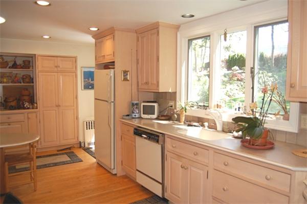 4 Sherburne Road Lexington, MA 02421 - Photo 8 of 21 a kitchen with stainless steel appliances sink refrigerator and window