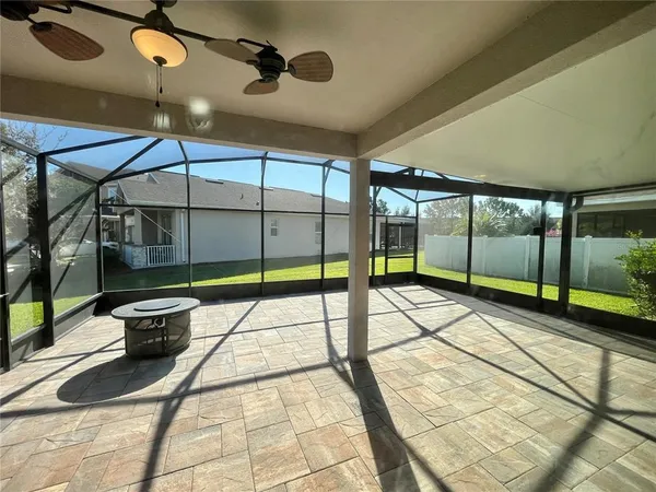 a view of an empty room with windows