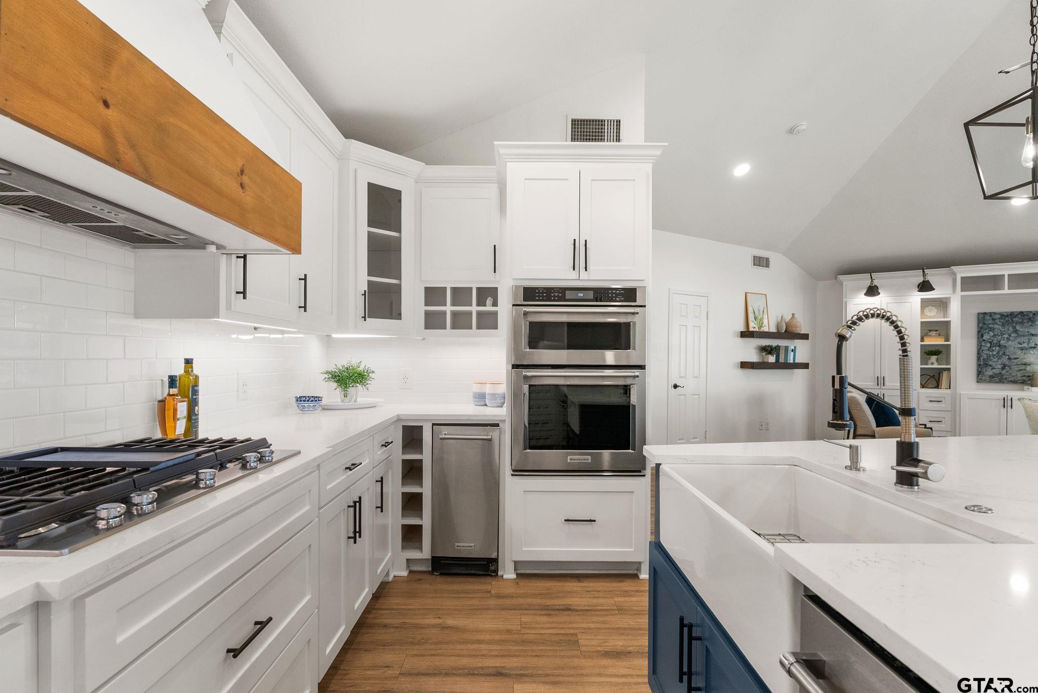 13235 Peninsula Road Whitehouse, TX 75791 - Photo 11 of 48 a kitchen with a sink stove and refrigerator