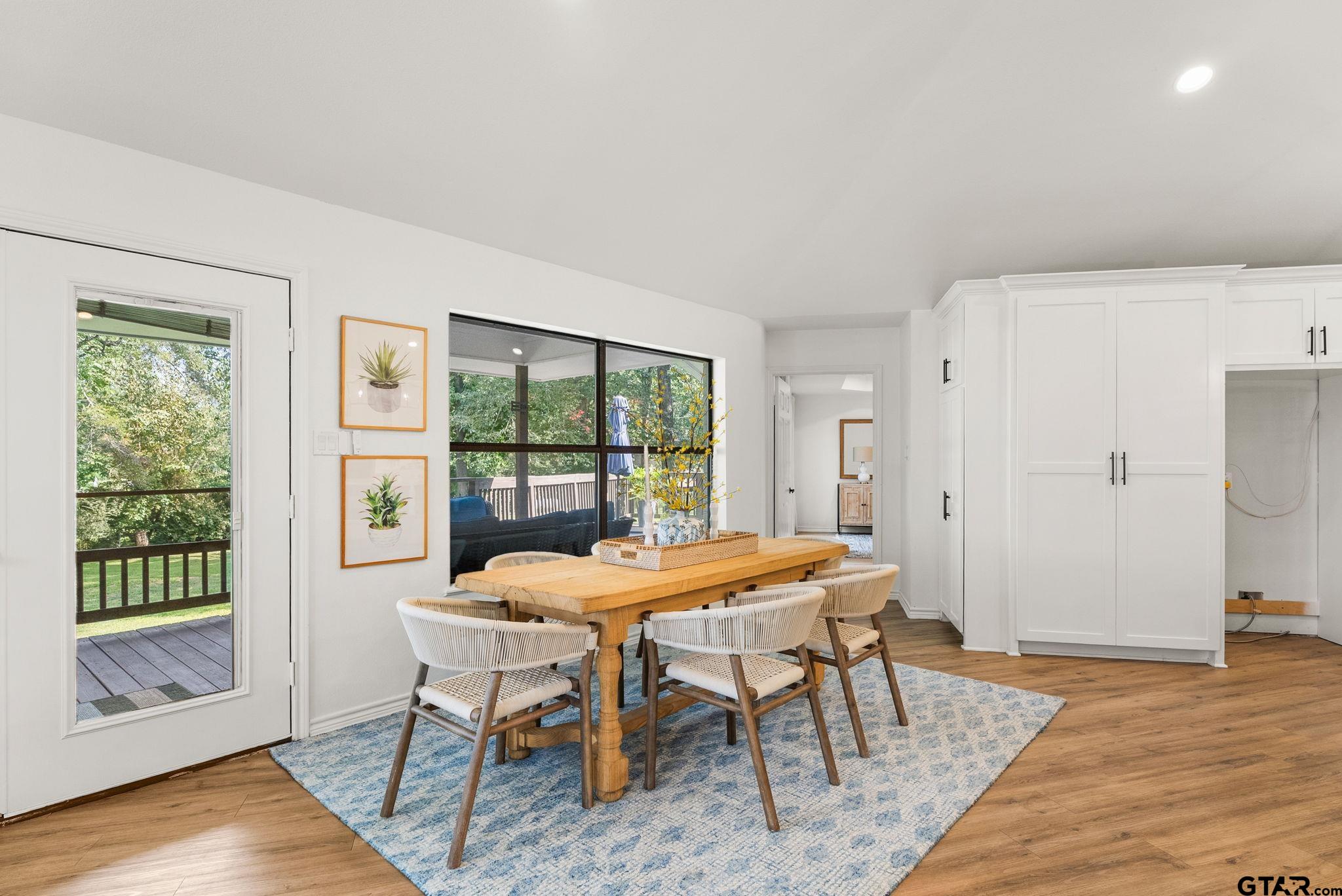 13235 Peninsula Road Whitehouse, TX 75791 - Photo 14 of 48 a dining room with furniture and wooden floor